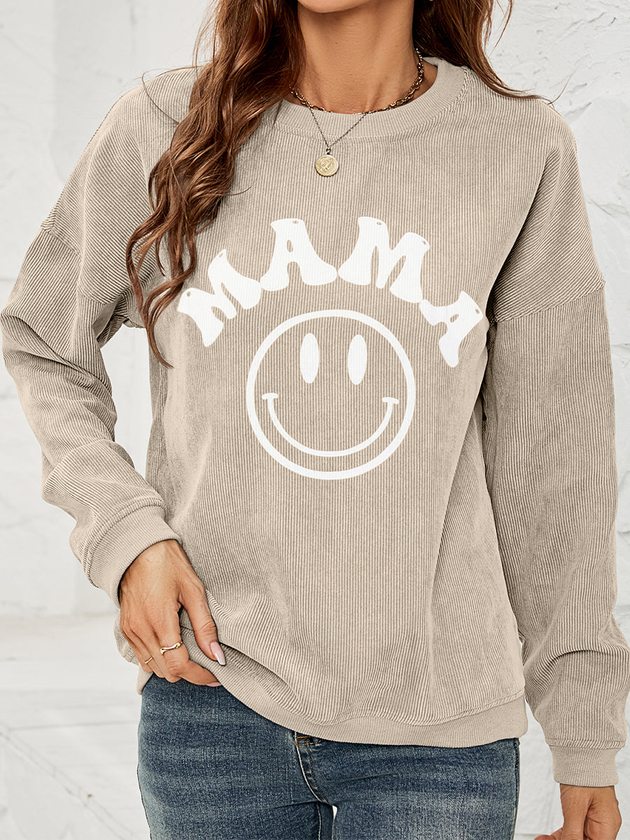 Corded sweatshirt in beige with smiley face and says "MAMA"